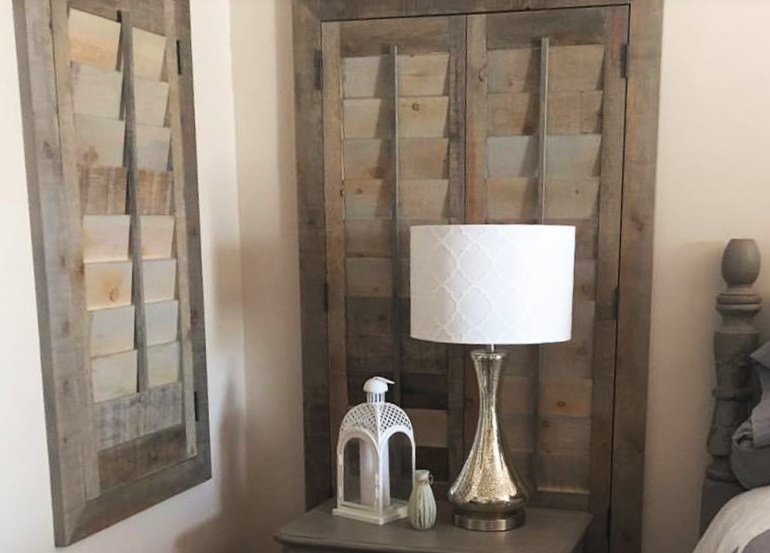 Southern California bedroom with repurposed wood shutters.